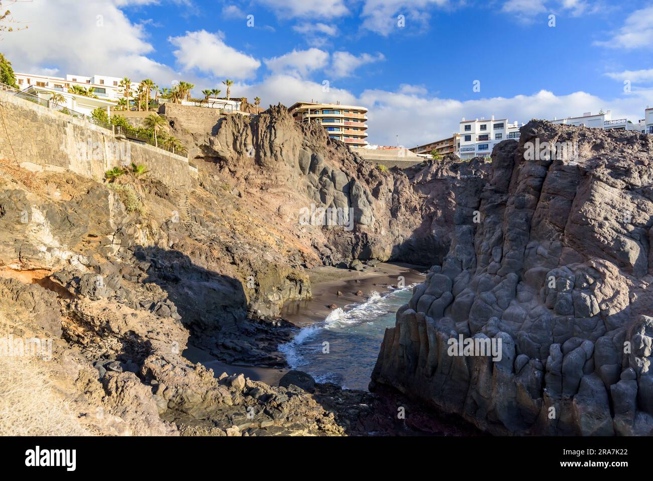 Small picturesque beach amongst the cliffs in Los Gigantes on Tenerife. Canary Islands, Spain Stock Photo