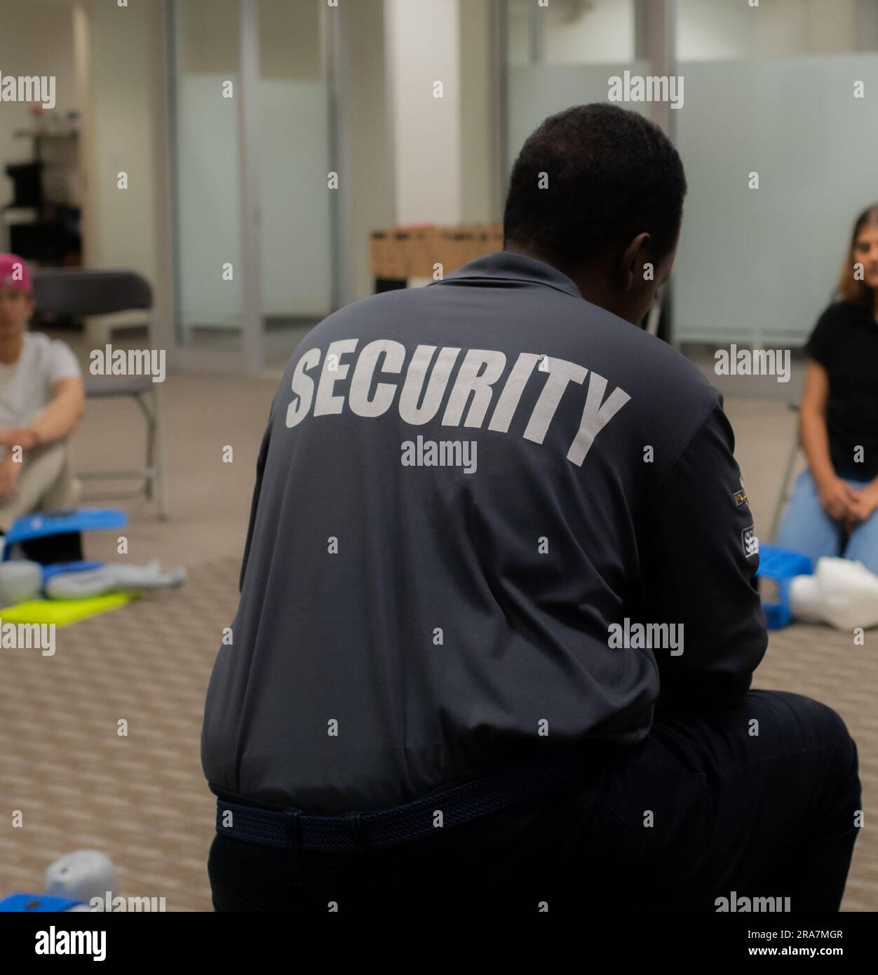 CPR training class by security guard in office Stock Photo Alamy
