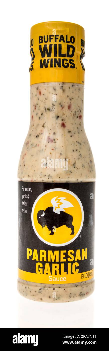 Winneconne, WI - 25 June 2023: A bottle of Buffalo wild wings sauce parmesan garlic on an isolated background. Stock Photo