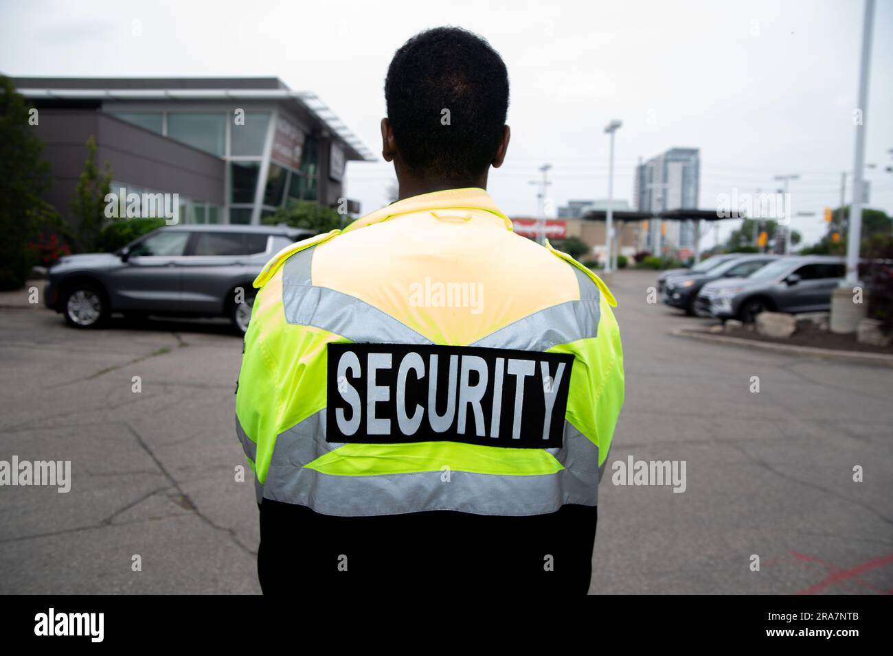 Security guard patrolling office parking space Stock Photo Alamy