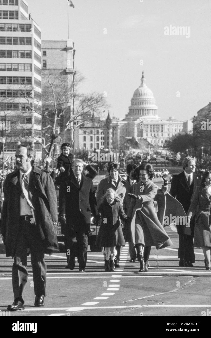 Jimmy Carter and his family - after being  sworn in as 39th President of the United States - walks down Pennsylvania Avenue on the way to the White House. By Carter's side is his wife, Rosalynn and daughter Amy. Photograph by Bernard Gotfryd Stock Photo