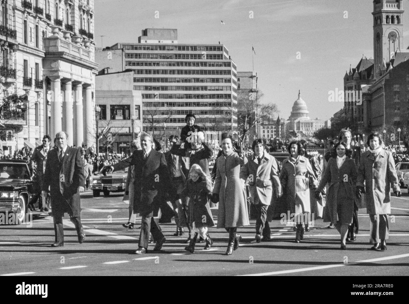 Jimmy Carter and his family - after being  sworn in as 39th President of the United States - walks down Pennsylvania Avenue on the way to the White House. By Carter's side is his wife, Rosalynn and daughter Amy. Photograph by Bernard Gotfryd Stock Photo