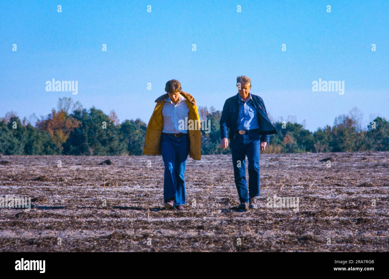 President Jimmy Carter and his son, Chip Carter, walk the dormant winter fields of the Carter Farm in Plains, Georgia. The President was on vacation and making his first visit to his hometown since his inauguration. Photo by Bernard Gotfryd Stock Photo