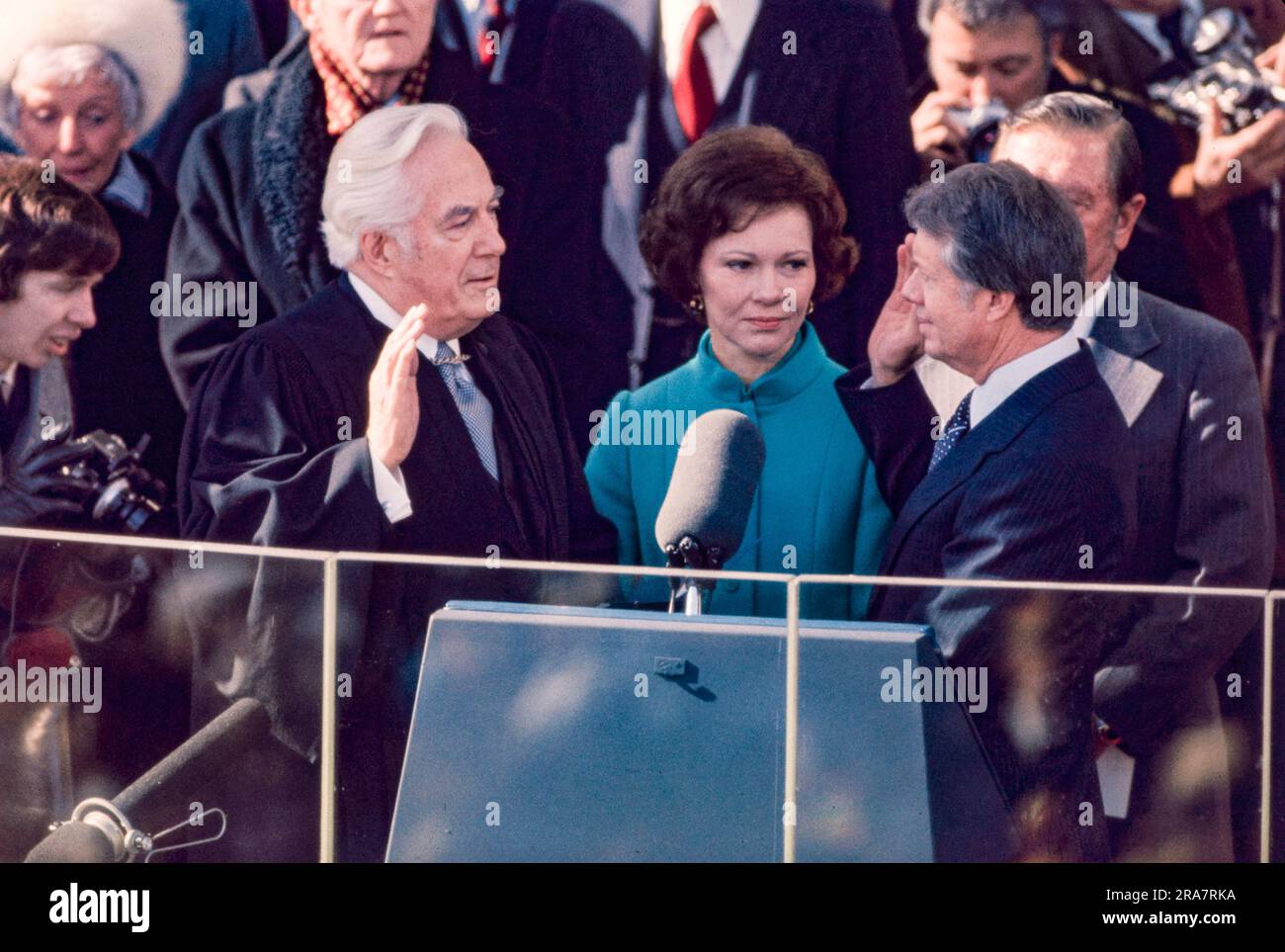 Jimmy Carter is sworn in as 39th President of the United States by Supreme Court Chief Justice Warren Burger. By Carter's side is his wife, Rosalynn and Vice President Walter Mondale. Photograph by Bernard Gotfryd Stock Photo
