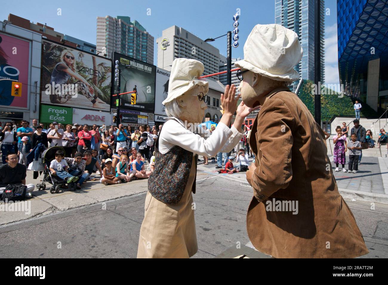 Toronto, Ontario / Canada - Aug 28, 2015: Actor and actress dressed as the seniors play on a street festival Stock Photo