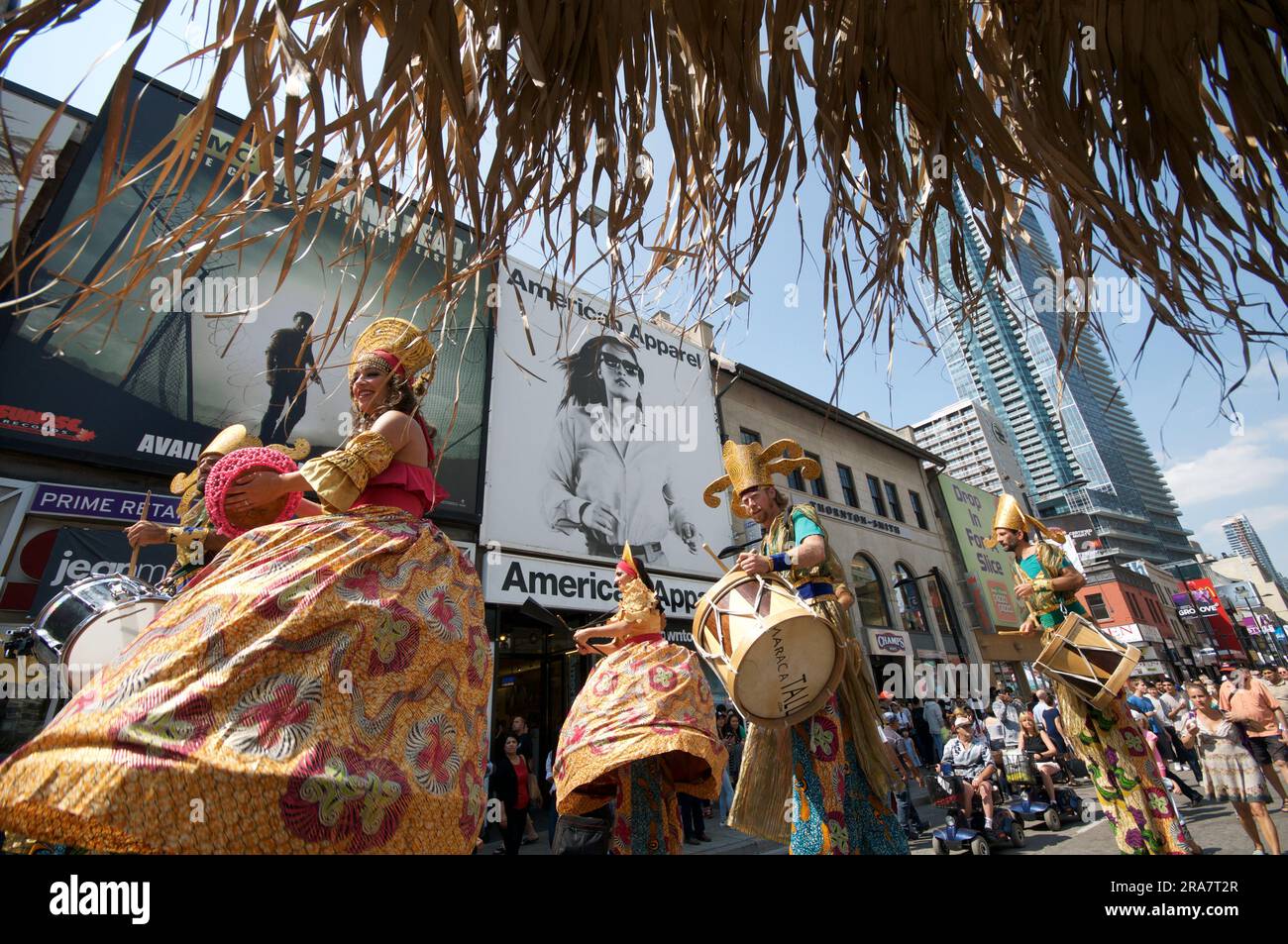 Toronto, Ontario / Canada - Aug 28, 2015: Performers on stilts playing musical instruments in a street festival Stock Photo