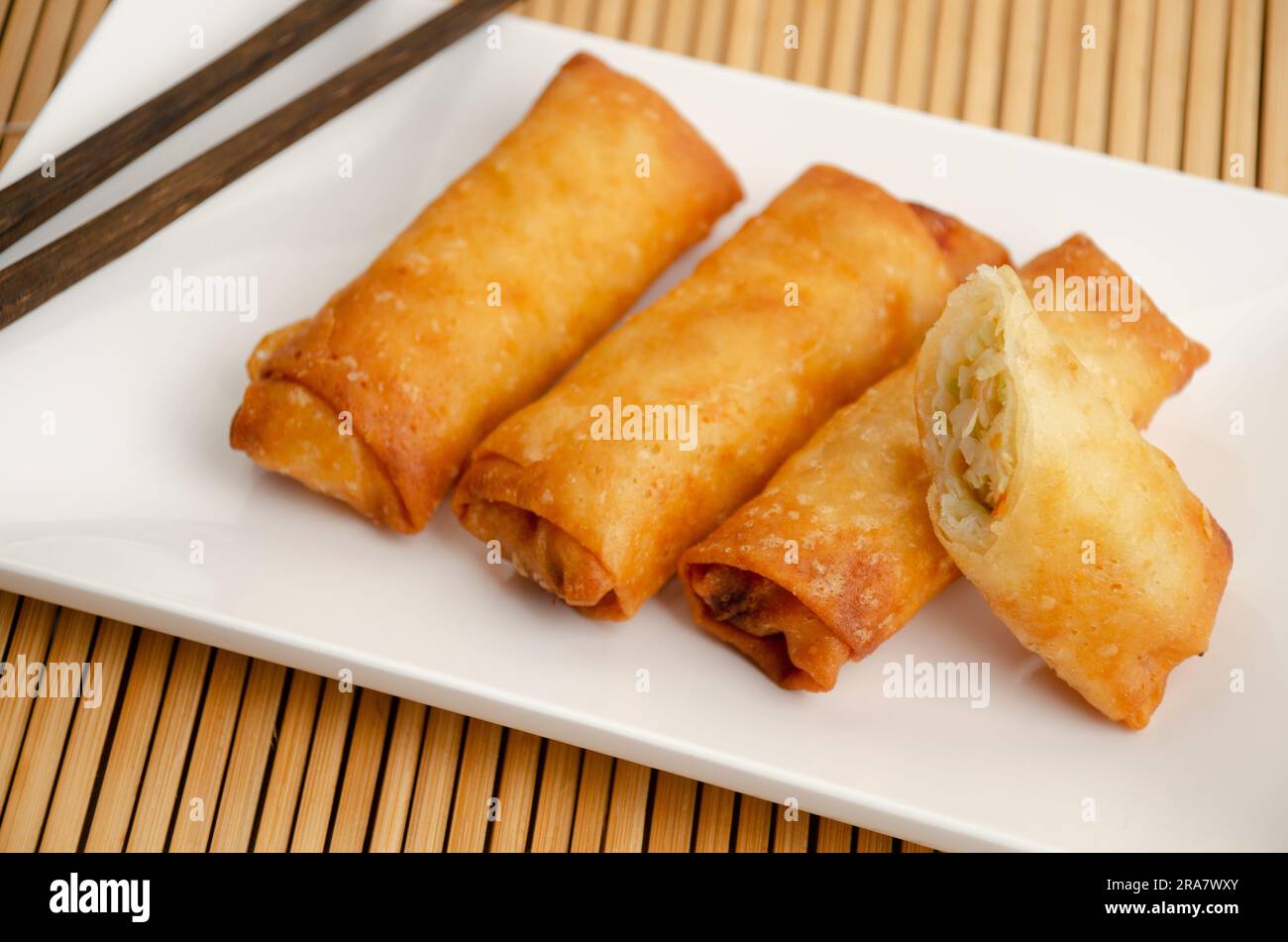 Spring rolls, a flavorful and crispy Asian appetizer filled with fresh vegetables and often served with a dipping sauce Stock Photo