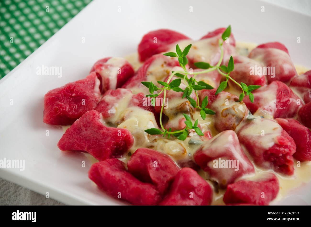 Beetroot gnocchi with white sauce, a vibrant and delightful Italian