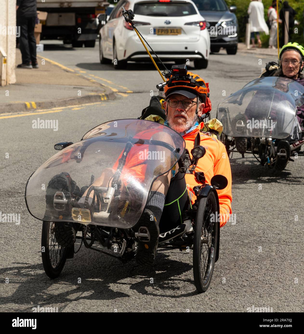 Portree, Isle of Skye, Scotland,UK. 5 June 2023. Recumbent cyclists cycling through Portree town centre during a tour of Skye. Scotland UK. Stock Photo