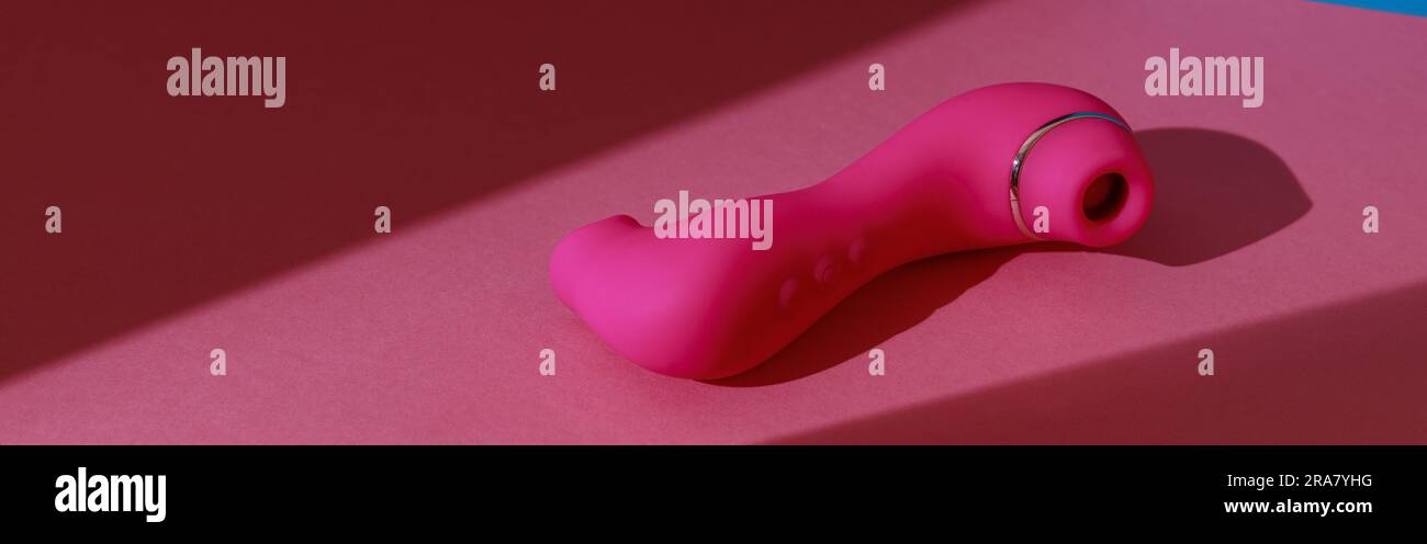 Sex toy for women also called vacuum clitoral stimulator for satisfaction  on pink background Stock Photo - Alamy