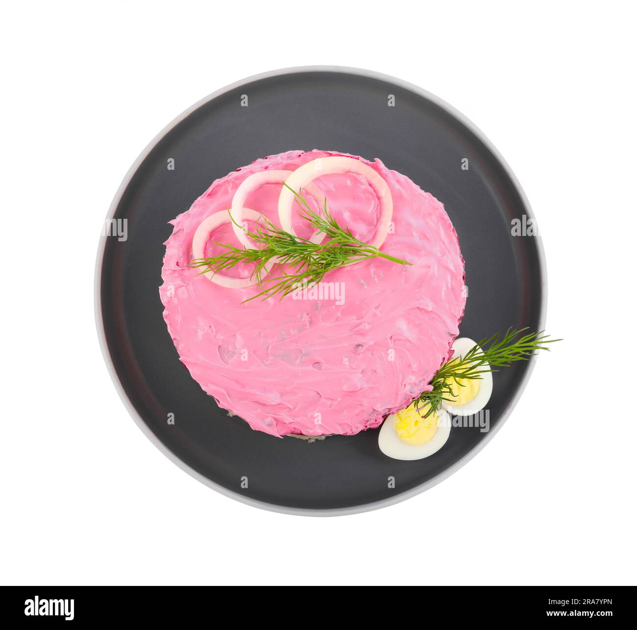 Herring under fur coat salad isolated on white, top view. Traditional Russian dish Stock Photo