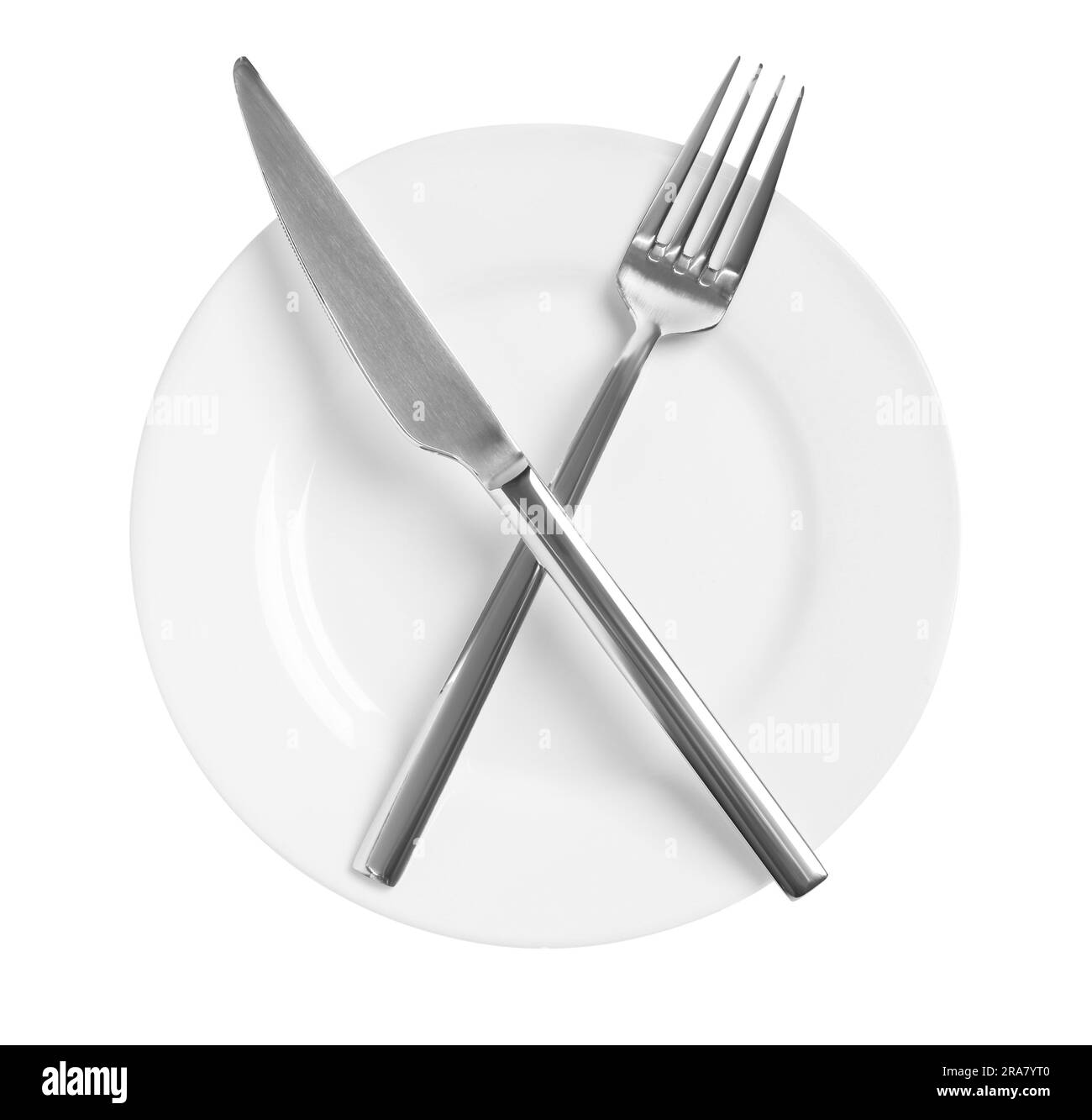 Clean plate with shiny cutlery on white background, top view Stock