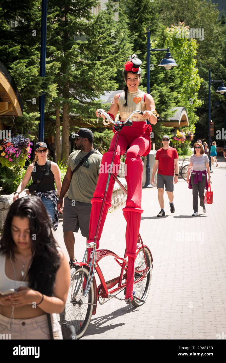 Street Entertainers and tourists in the Whistler Village on Canada Day, 2023.  Whistler BC, Canada. Stock Photo