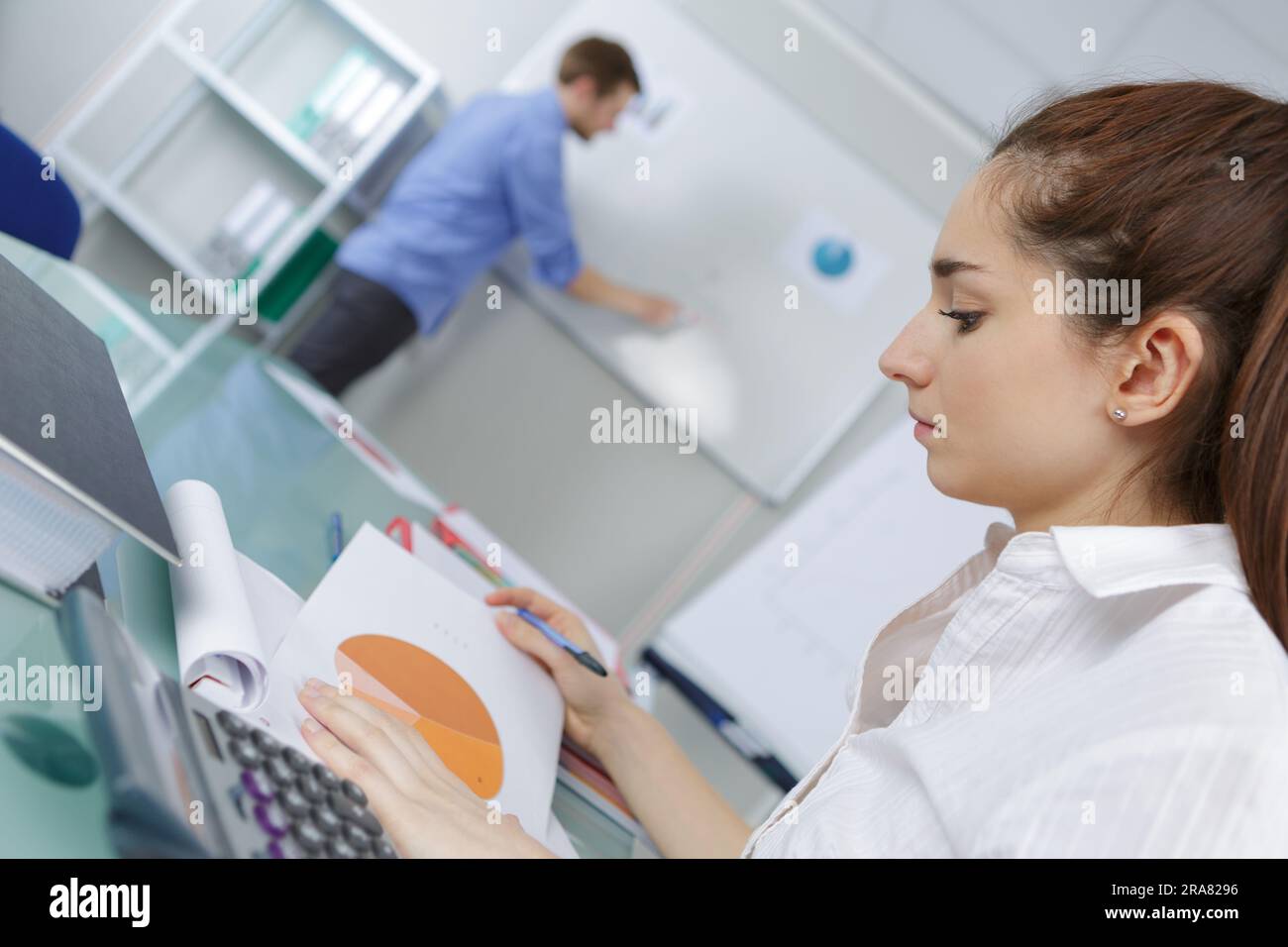 woman looking at handwritten notes and diagram Stock Photo - Alamy