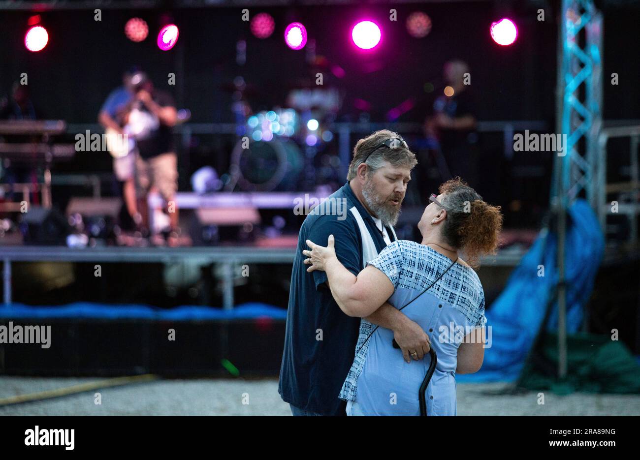 Sam and Pam Gibbons of Portland, Tenn., mouths the lyrics of "Tennessee