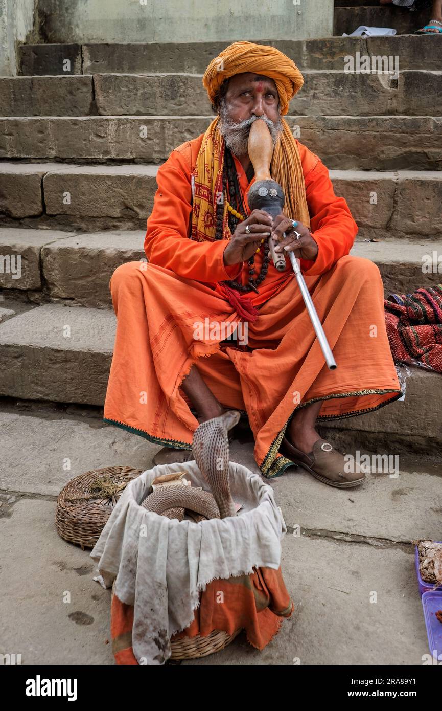 Snake charmers on gaths on the Ganges in Varanasi (Benares), India