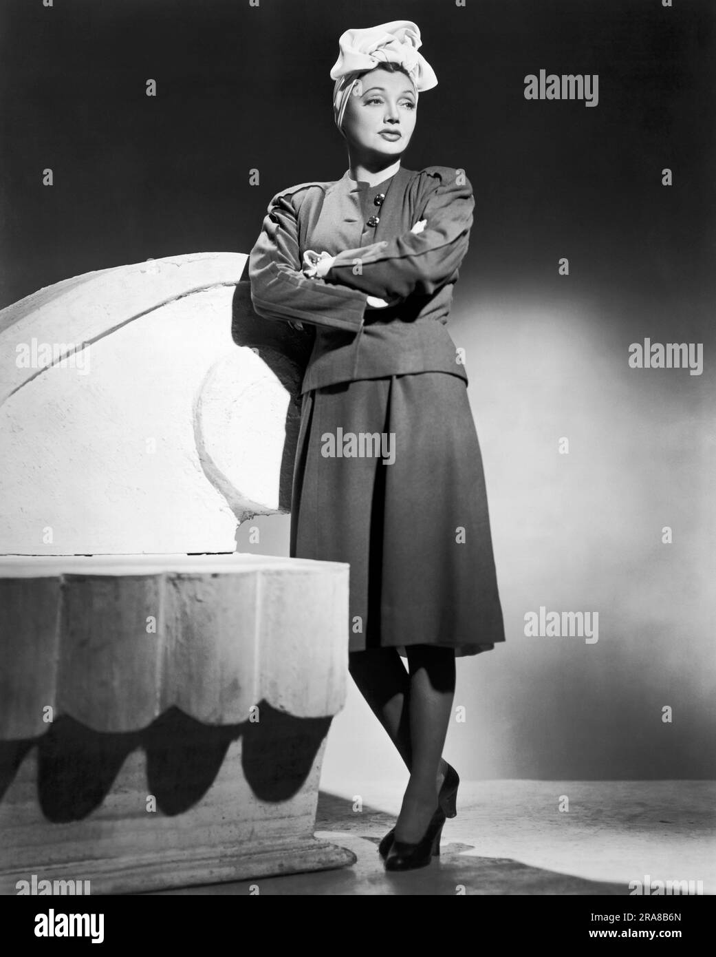 Chicago, Illinois:  c. 1938 A portrait of a sultry woman leaning aginst a stage prop. Stock Photo