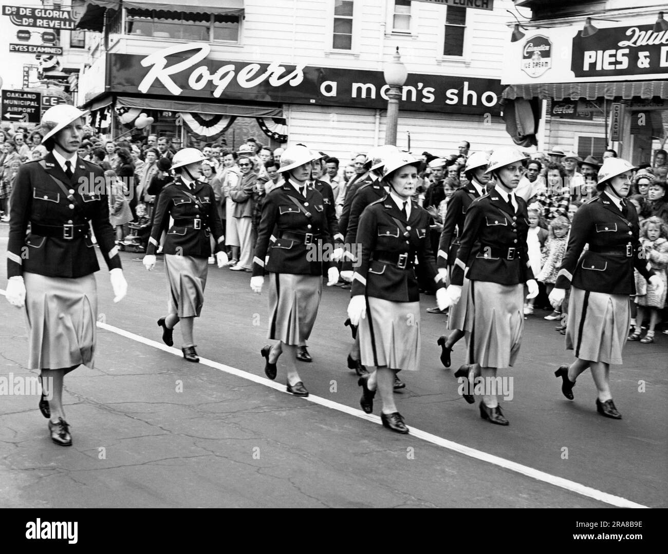 Oakland, California:  c. 1949 Women in uniform marching in a parade. Stock Photo