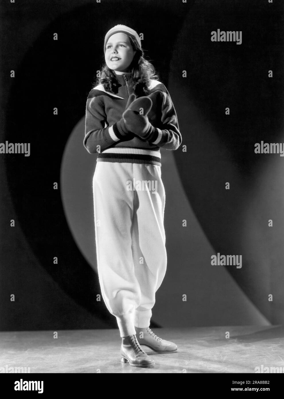 Hollywood, California:  1935 Actress Helen Parrish models a fashionable winter outfit. She is currently starring in 'A Dog of Flanders'. Stock Photo