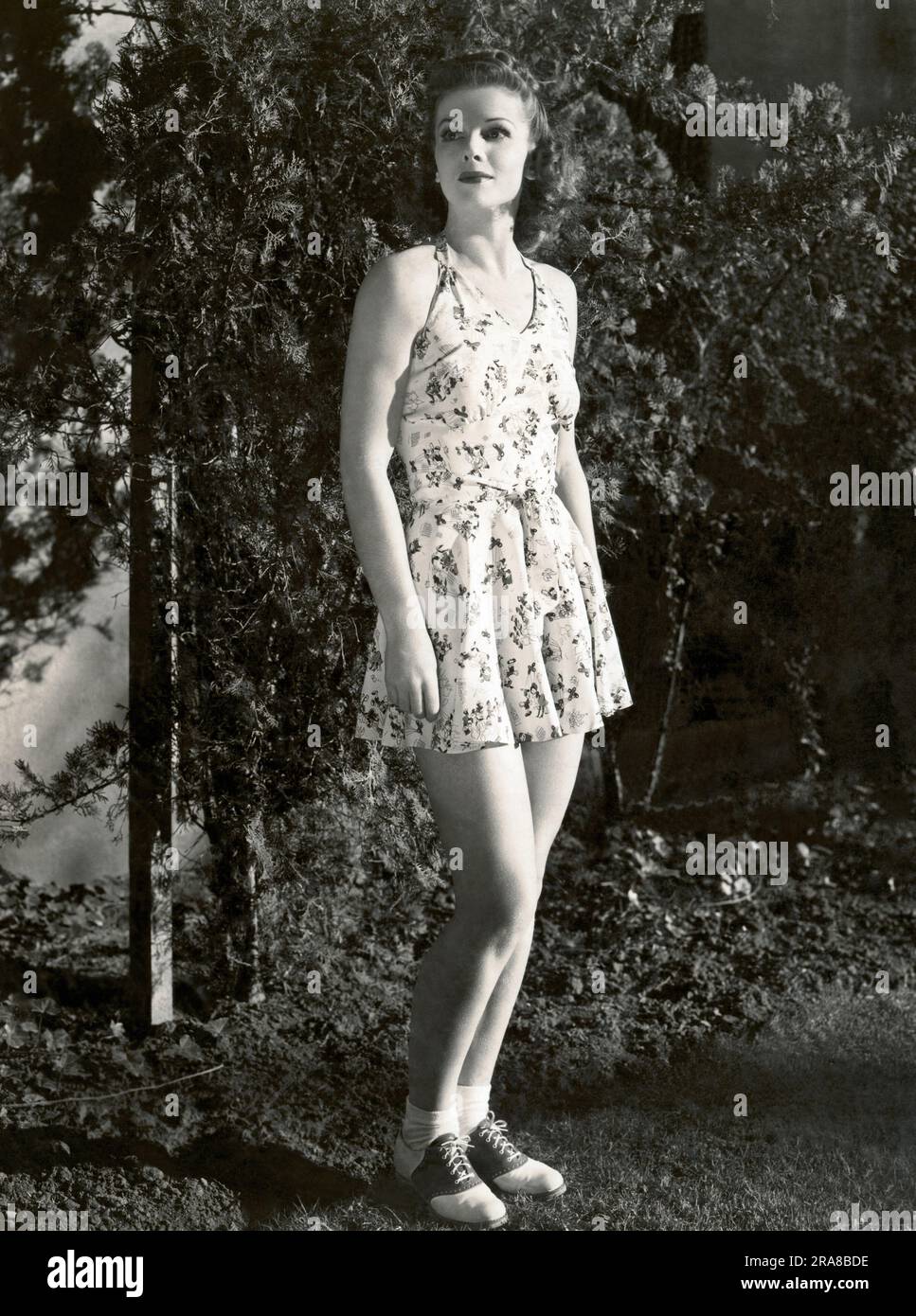 Hollywood, California:  1940 Actress Linda Hayes wearing a summer frock and saddle shoes. Stock Photo