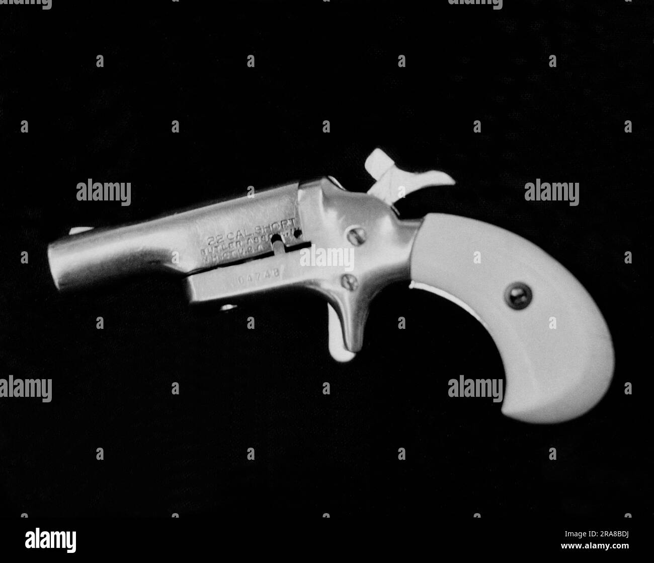 United States:  c. 1972 A photograph of an old single shot 22 caliber derringer. Stock Photo