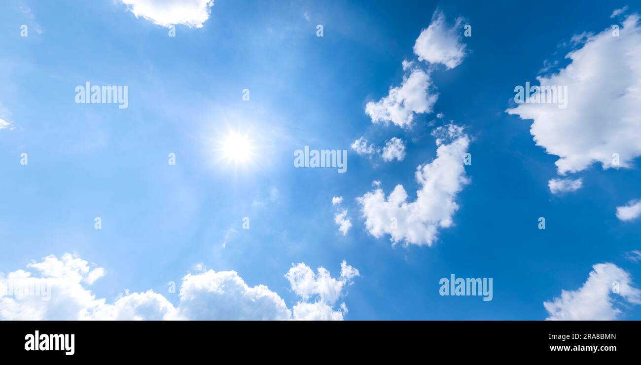 Fluffy white cumulus clouds in the blue sky Stock Photo - Alamy
