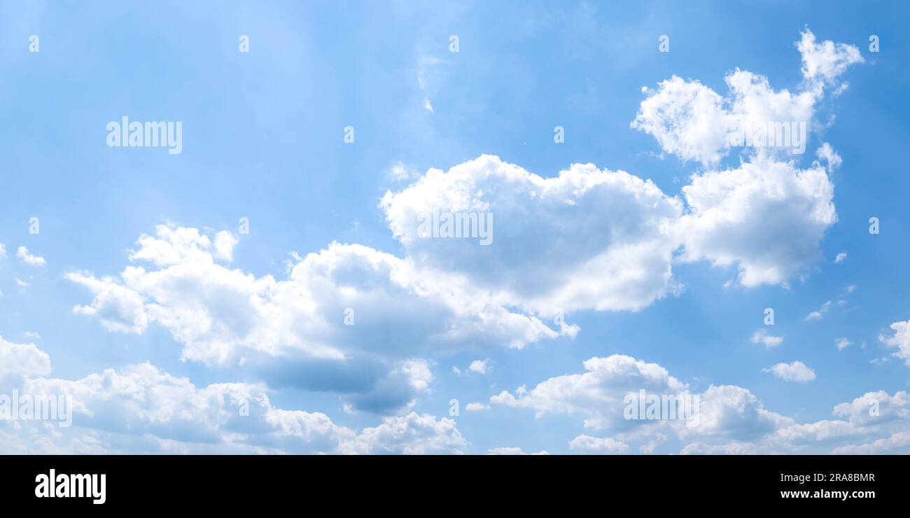 Fluffy white cumulus clouds in the blue sky Stock Photo - Alamy