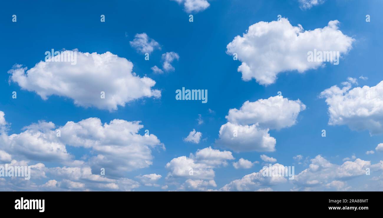 Fluffy white cumulus clouds in the blue sky Stock Photo - Alamy