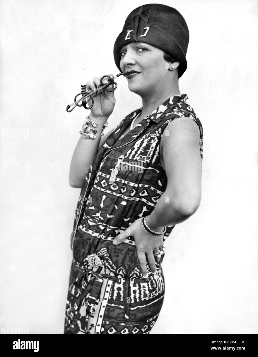 New York, New York:  October 13, 1926 Popular stage actress Irene Bordini with her pretzel cigarette holder as she arrives from Europe aboard the ocean liner, the S.S. France. Stock Photo