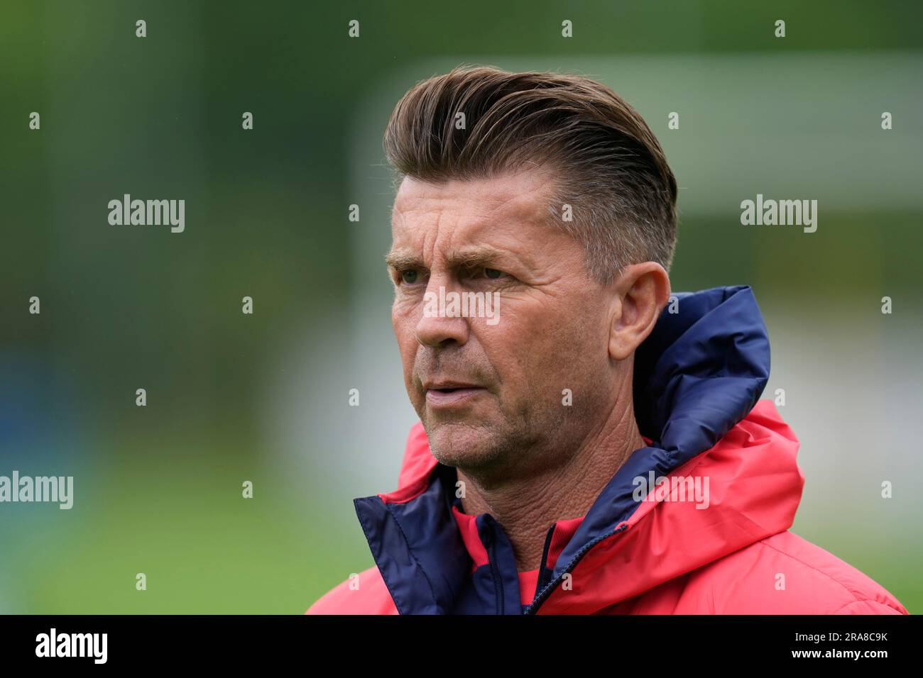 South Korea's women national soccer team coach Colin Bell walks on the field before a training