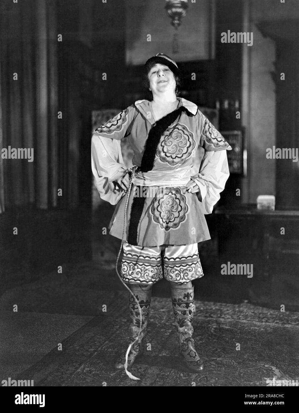 Ossining, New York:  c. 1928. A New York society matron in her Russian Cossack oufit that she will wear to the Thanksgiving party at the MacDowell Club. Stock Photo