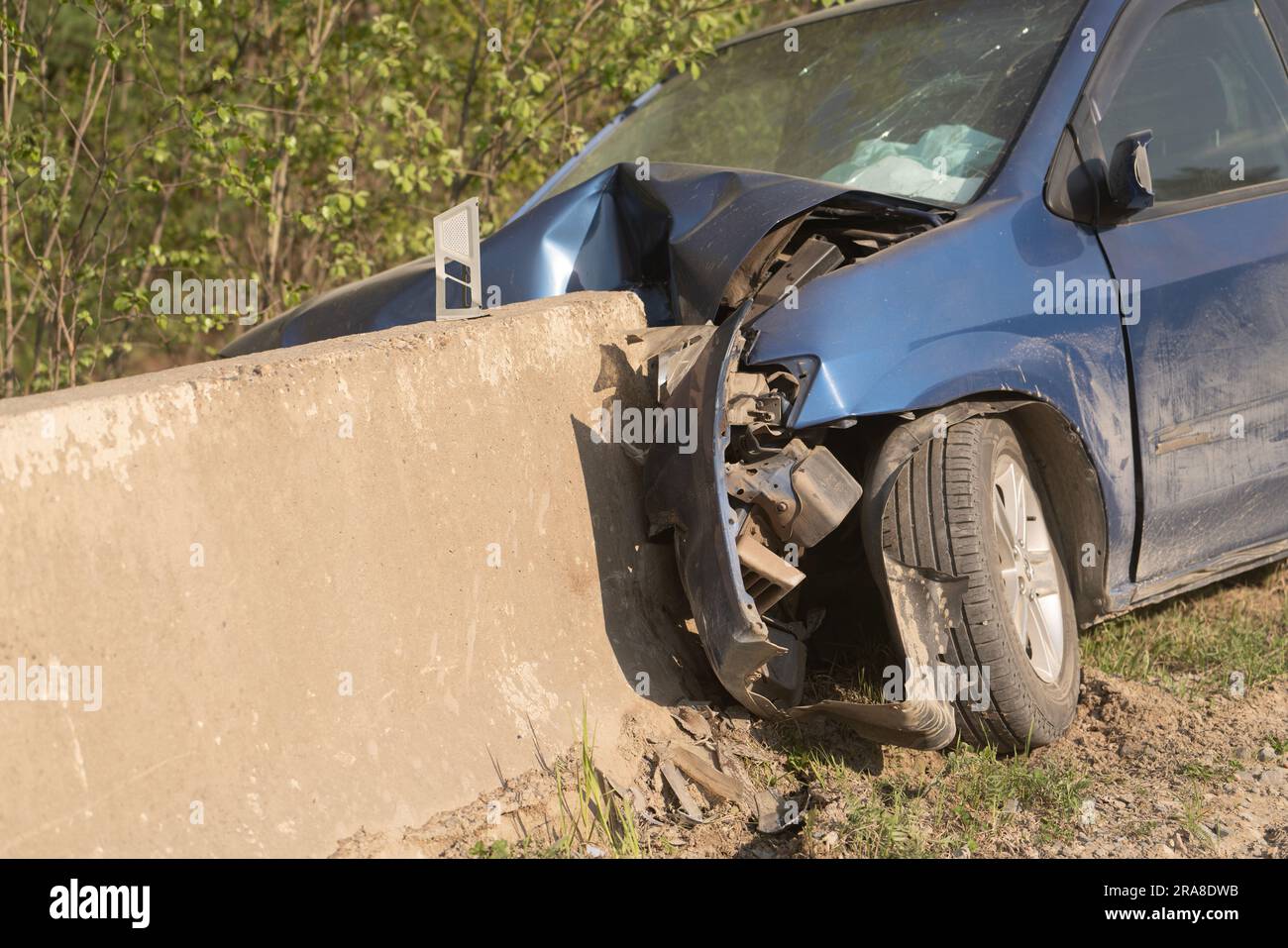Crash. The car crashed into a concrete fence. The airbags went off