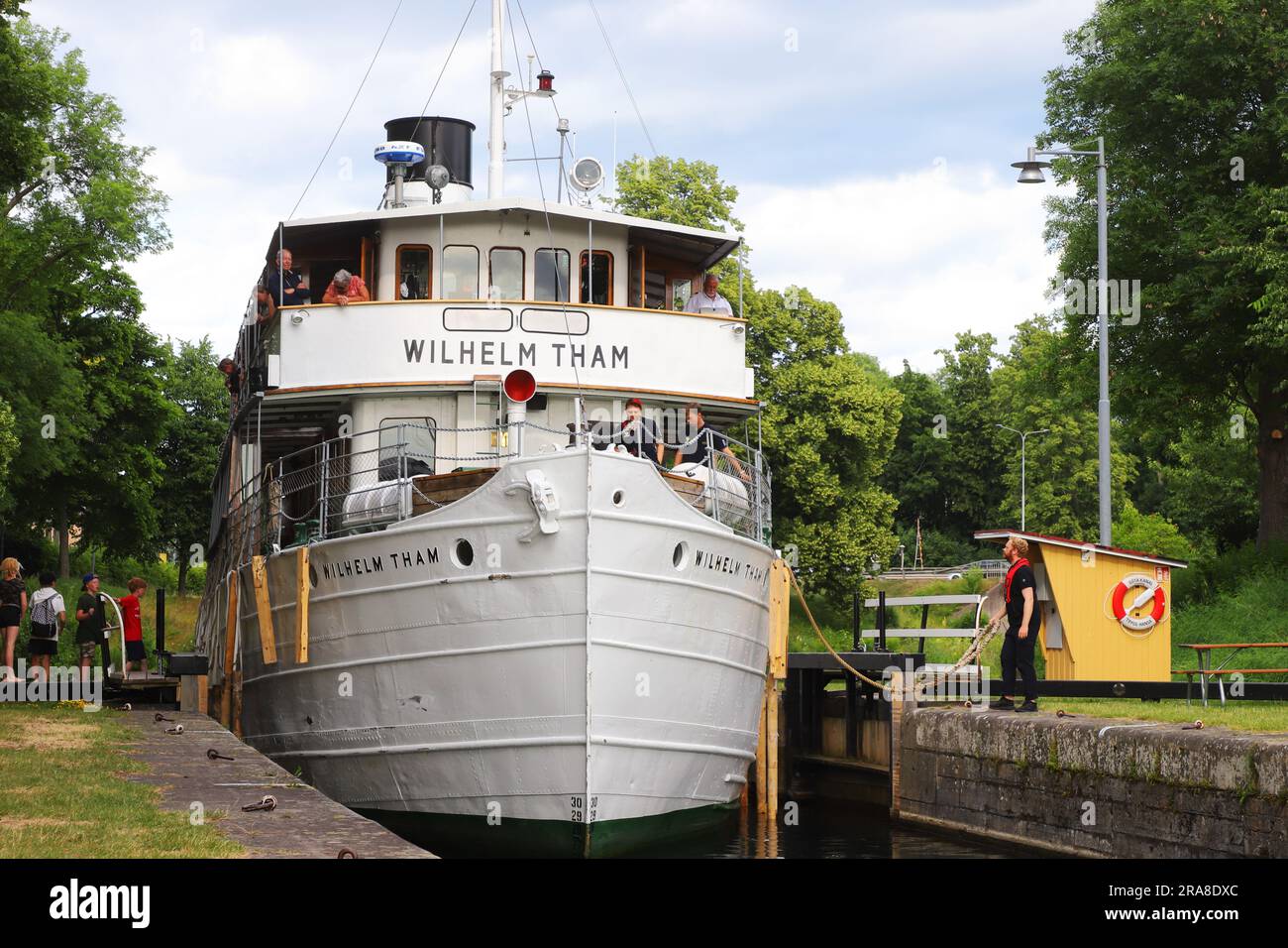 Motala, Sweden - June 27, 2023: The canal tour boat Wilhelm Tham at the Gota canal lock in Motala. Stock Photo