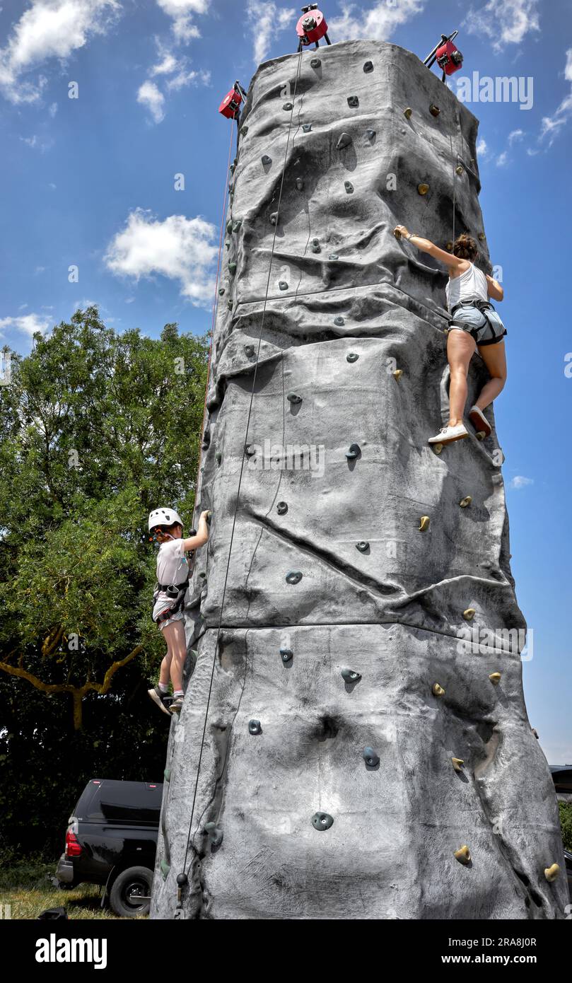 Woman and child Rock climbing on an artificial wall England UK Stock Photo