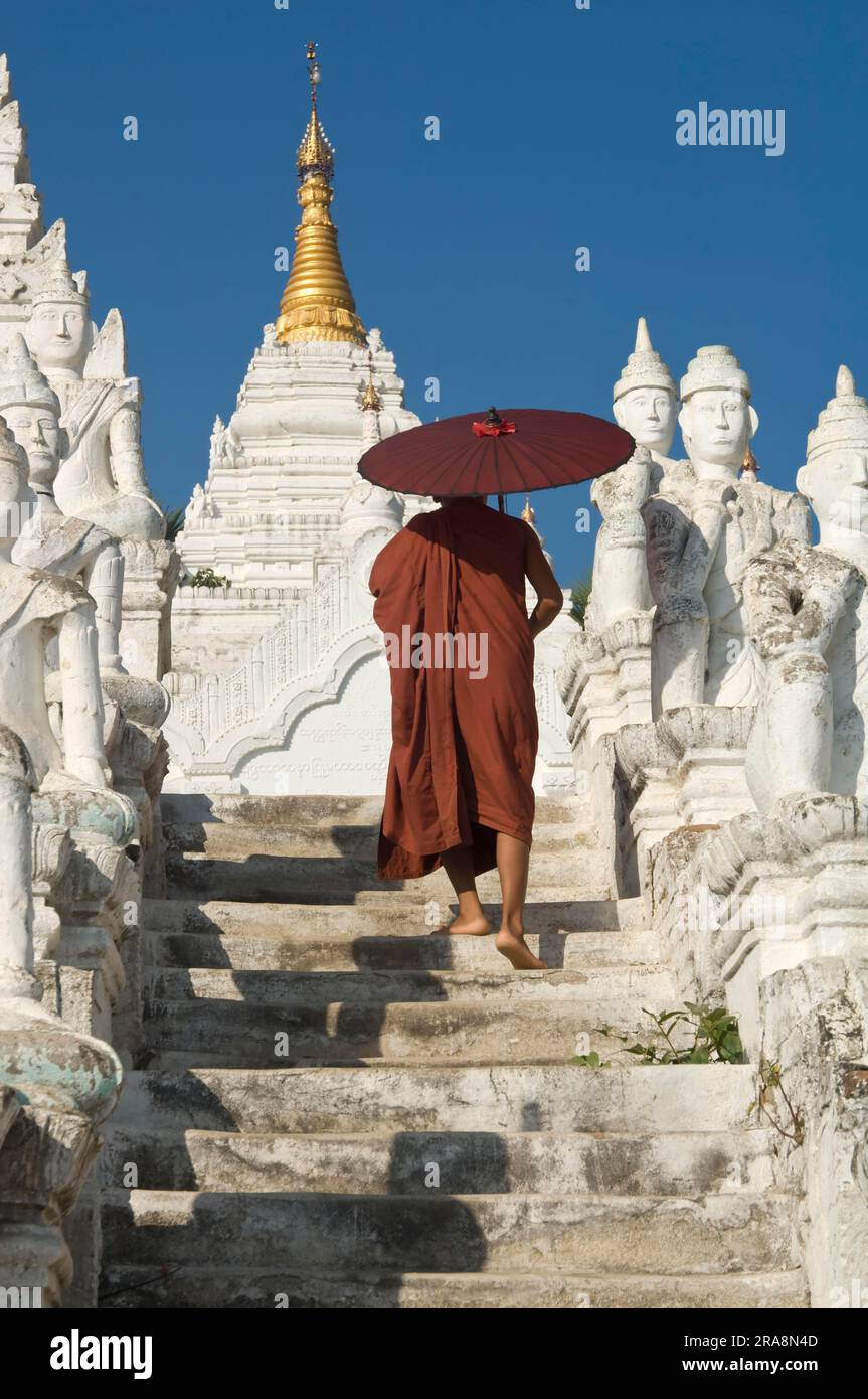 Buddhist monk with parasol, Set Taw Ya Pagoda, Mingun, Burma, Myanmar