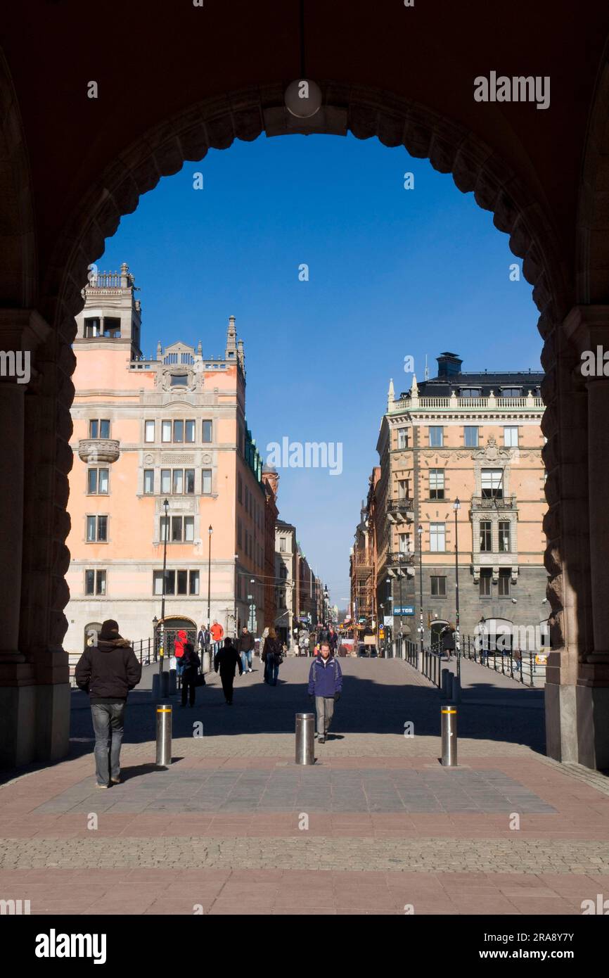 Archway at the Reichstag building, view of the shopping street Drottninggatan, Stockholm, Sweden, Riksdagshuset Stock Photo