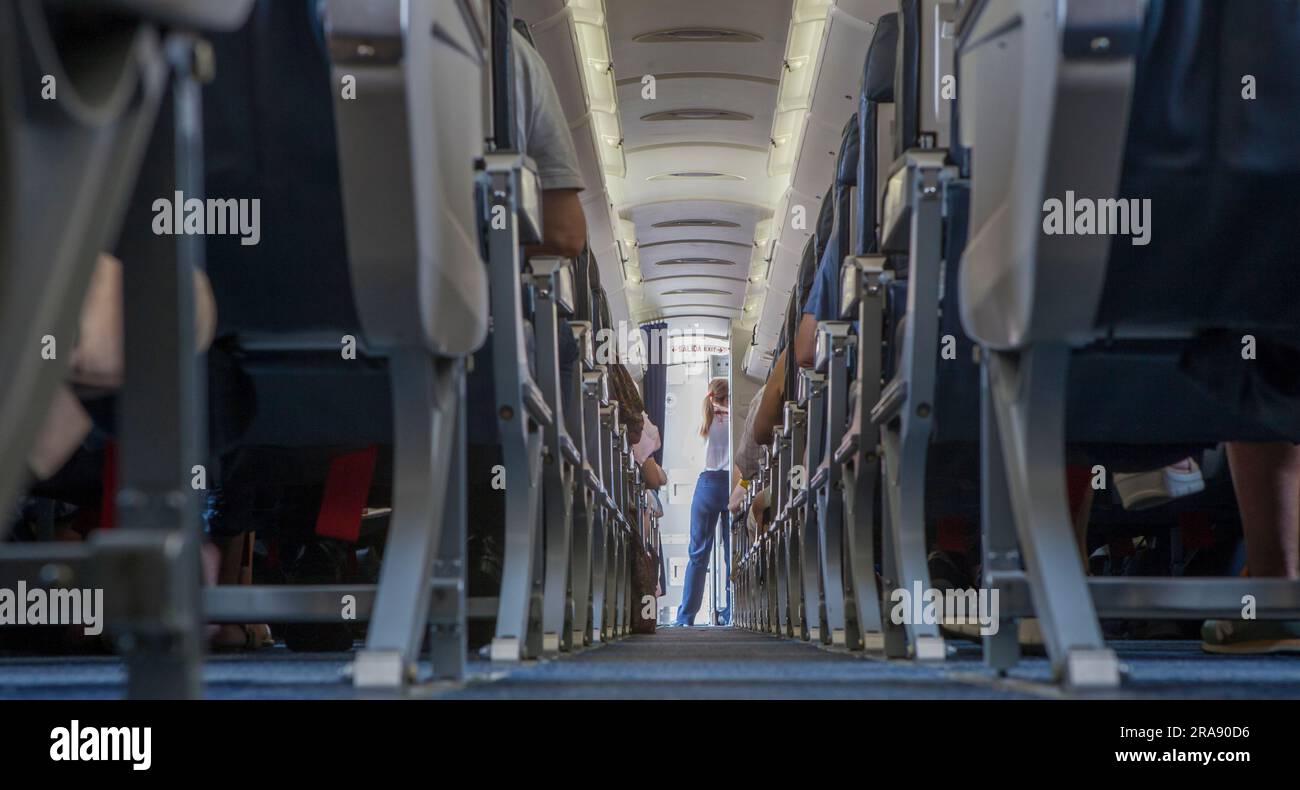 Normal class passenger jet airliner corridor. Ground view Stock Photo