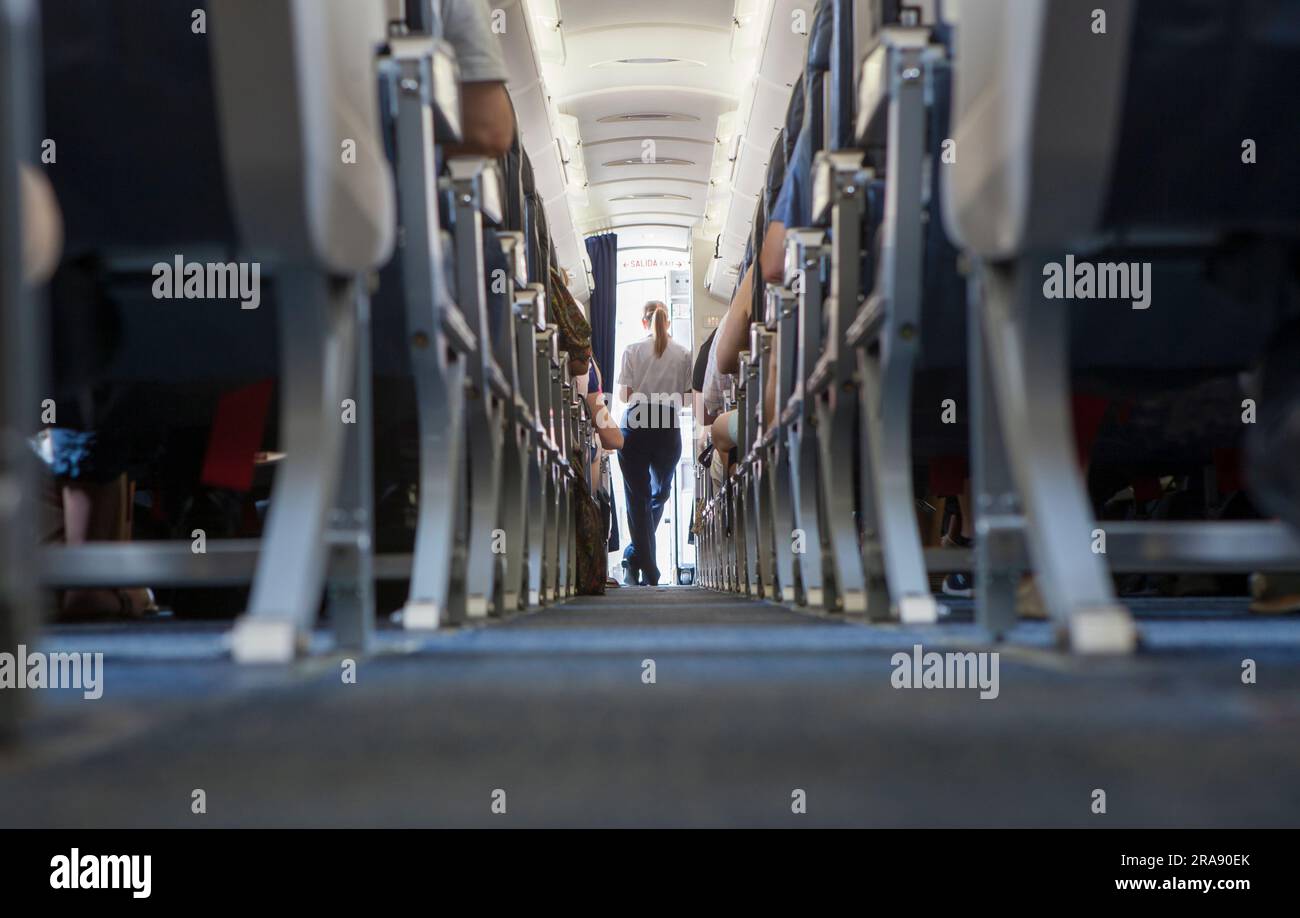Normal class passenger jet airliner corridor. Ground view Stock Photo
