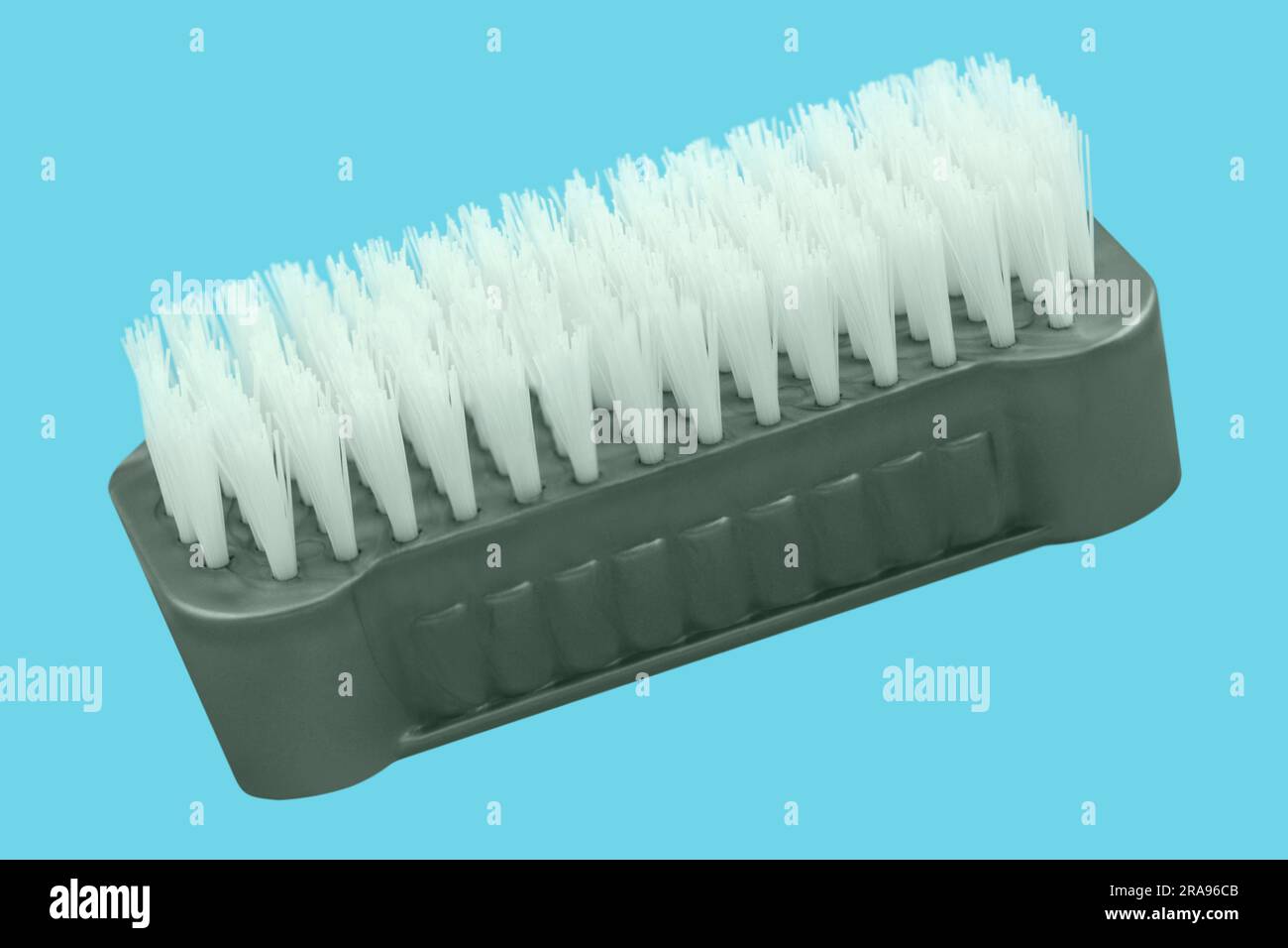 Nail brush against blue background Stock Photo Alamy