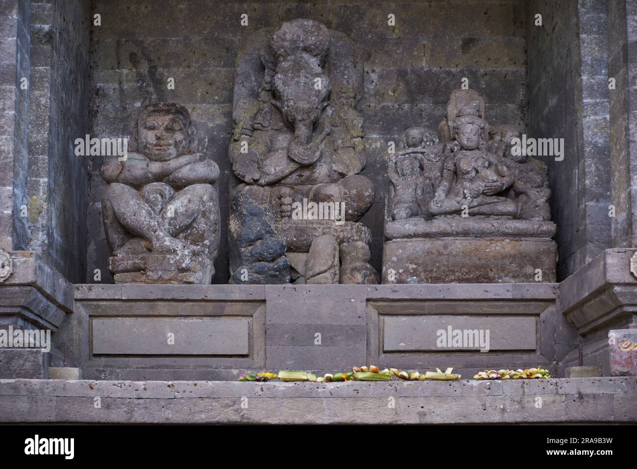 Budha and Ganesha Relic inside Goa Gajah or Elephant Cave   located on island of Bali near Ubud, in Indonesia. Built in the 9th century. Stock Photo