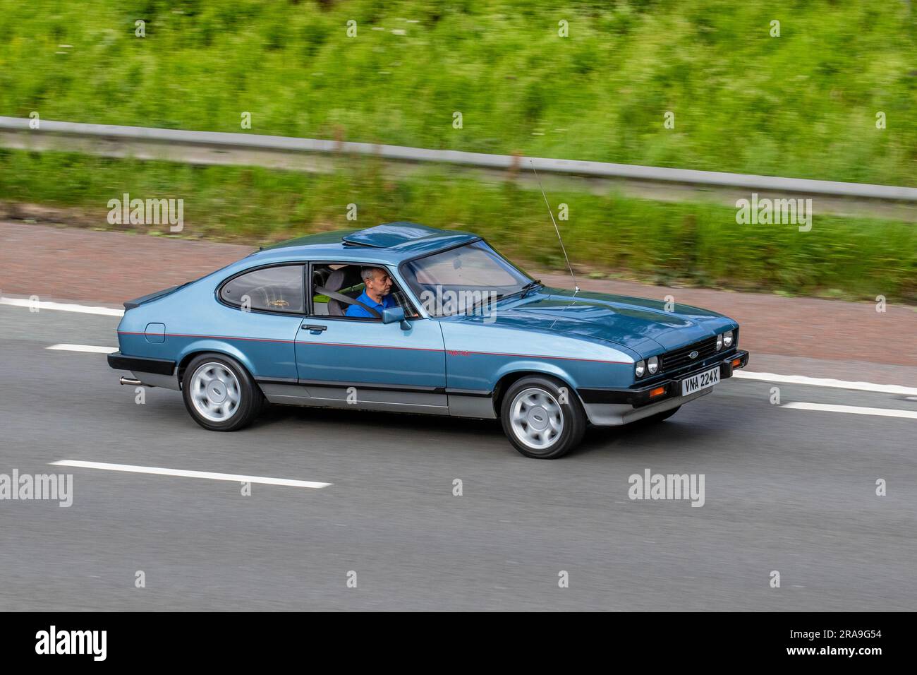 1981 80s eighties Ford Capri Injection V6 Blue Car Hatchback Petrol 2792 cc; travelling at speed