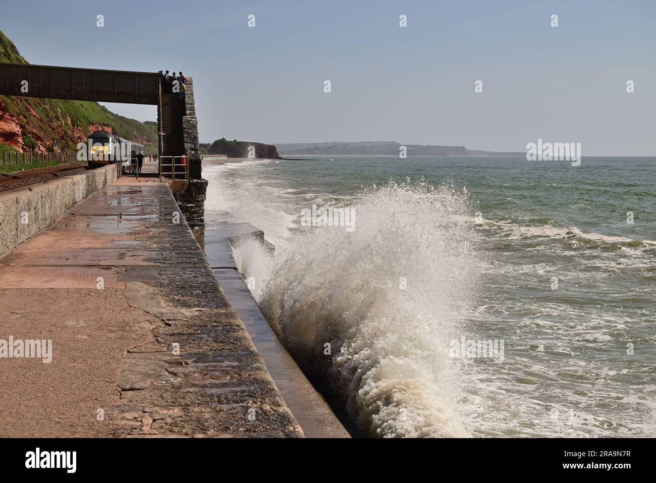 Waves crashing against the seawall at Rockstone Bridge, Dawlish, as a