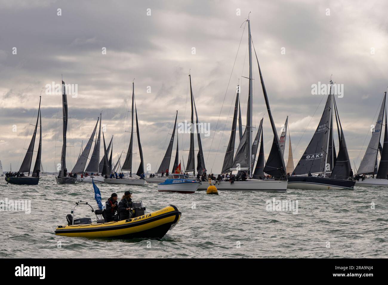 The sailboats bunch up at the start of the Round The Island yacht race