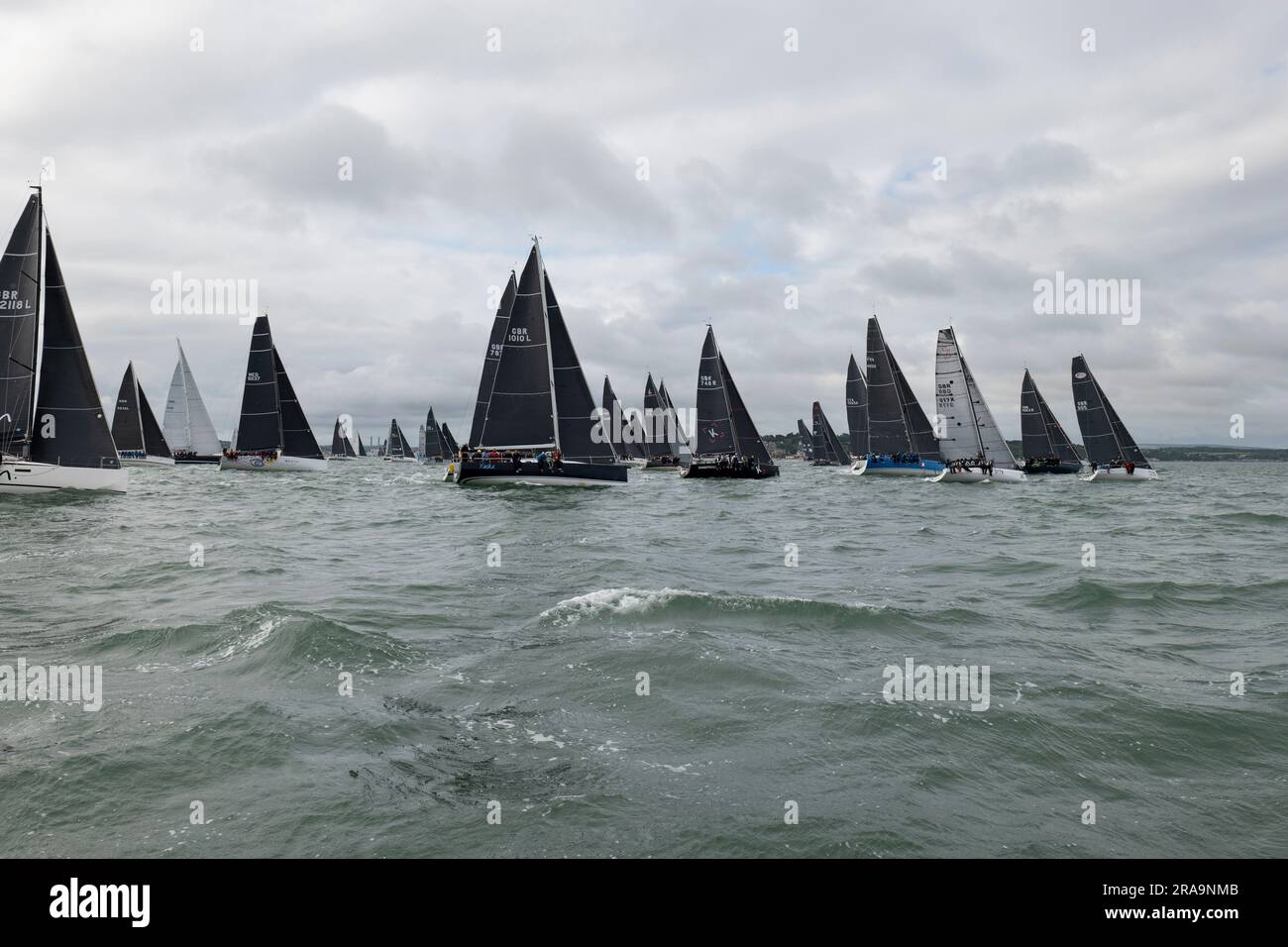 The Yachts are all lined up and ready to start the Isle of Wight Round The Island Sailboat race in the Solent on the South coast of England Stock Photo