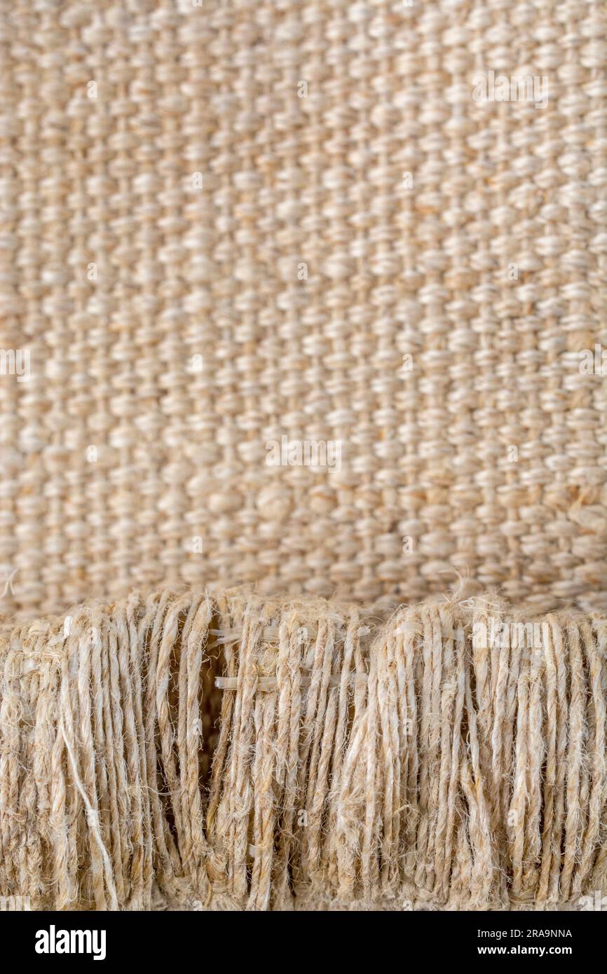 Close-up shot of worn seat fabric - appears to be mixed fibre not 100% cotton. For frayed edges, seen better days, out of condition metaphor. Stock Photo