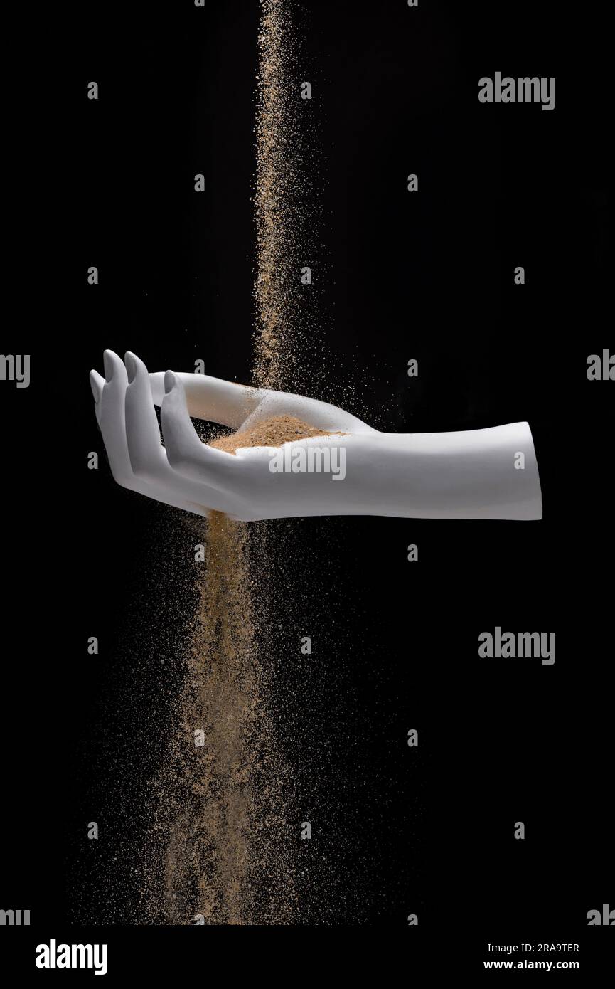 Time slipping away sand falling through hand Stock Photo Alamy