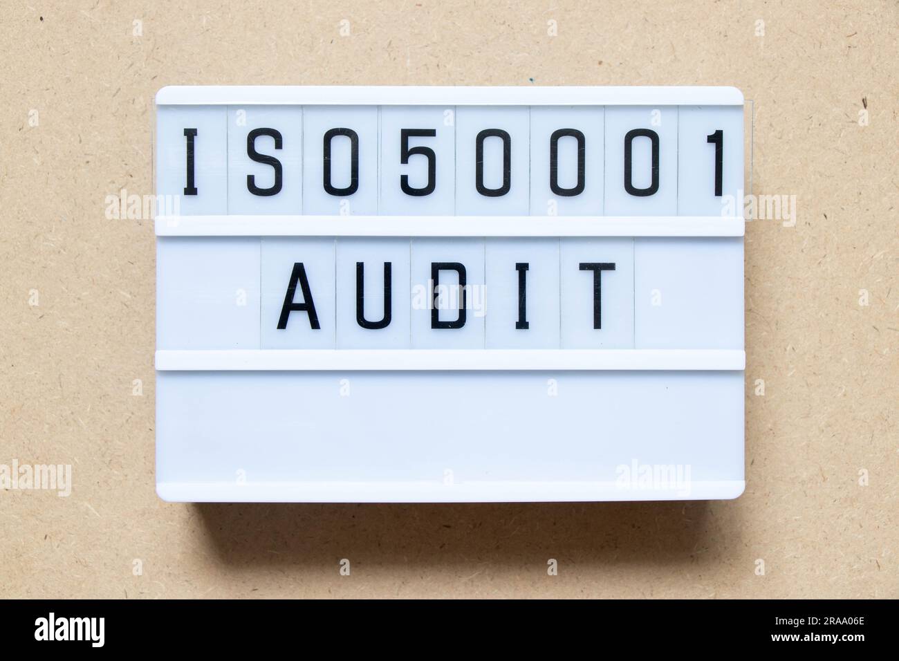 Lightbox with word ISO 50001 audit on wood background Stock Photo