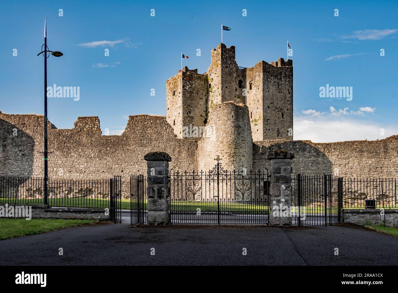 Flags flying at Trim Castle located across the road from the gates to the Cathedral Church of St