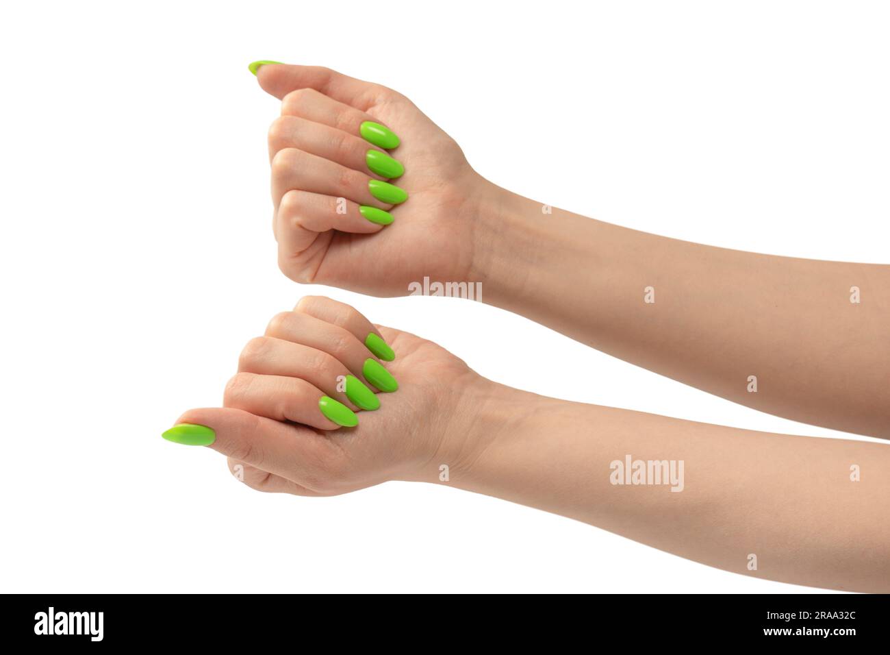 Hand of a woman with green naols hold some tiny or thin object, isolated on a white background. Stock Photo