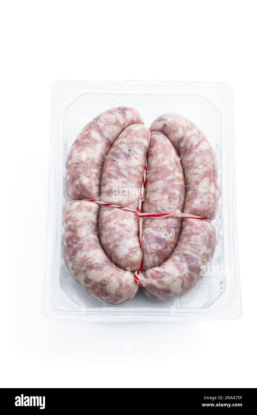 Raw pork  sausages in plastic pack isolated on white background Stock Photo